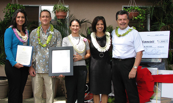 U.S. Congresswoman Tulsi Gabbard (far left) and State Representative Jessica Wooley (middle) present certificates to Habilitat and Toshiba executives, Jeffrey Nash (second from left) and Greg Valen (far right).