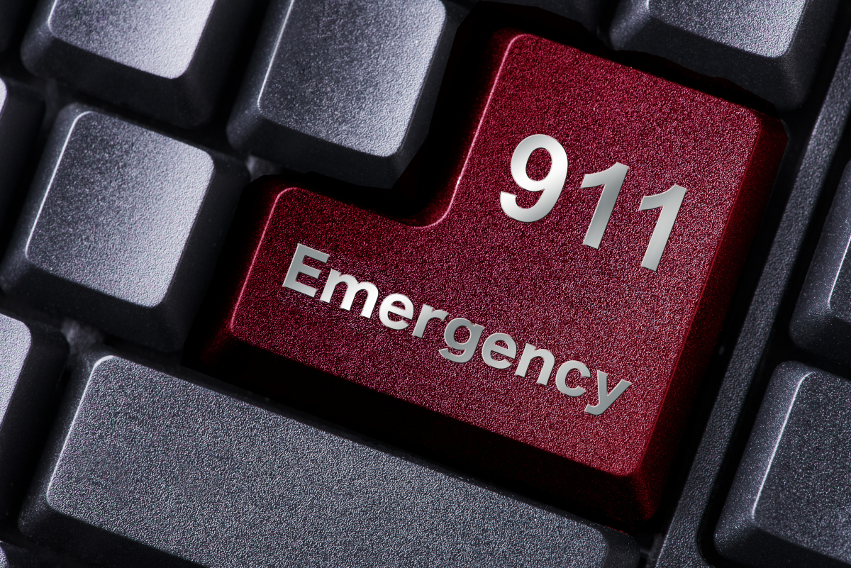 Red key on a keyboard stating 911 Emergency